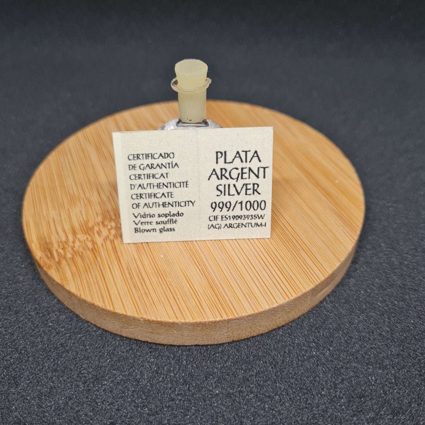 BOUTEILLE RONDE DE FEUILLES D'ARGENT