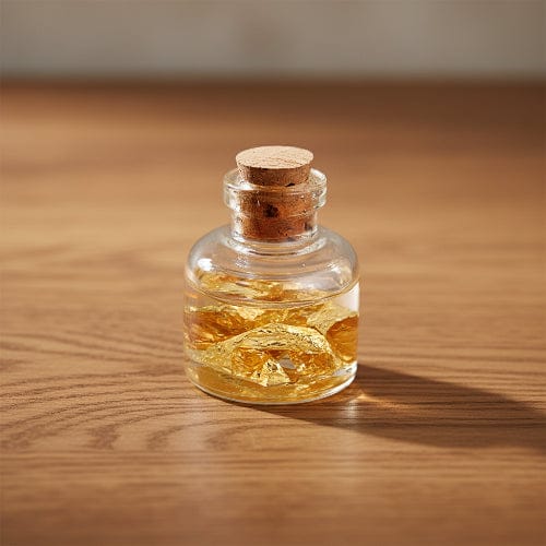 BOUTEILLE CARRÉE DE FEUILLES D'OR